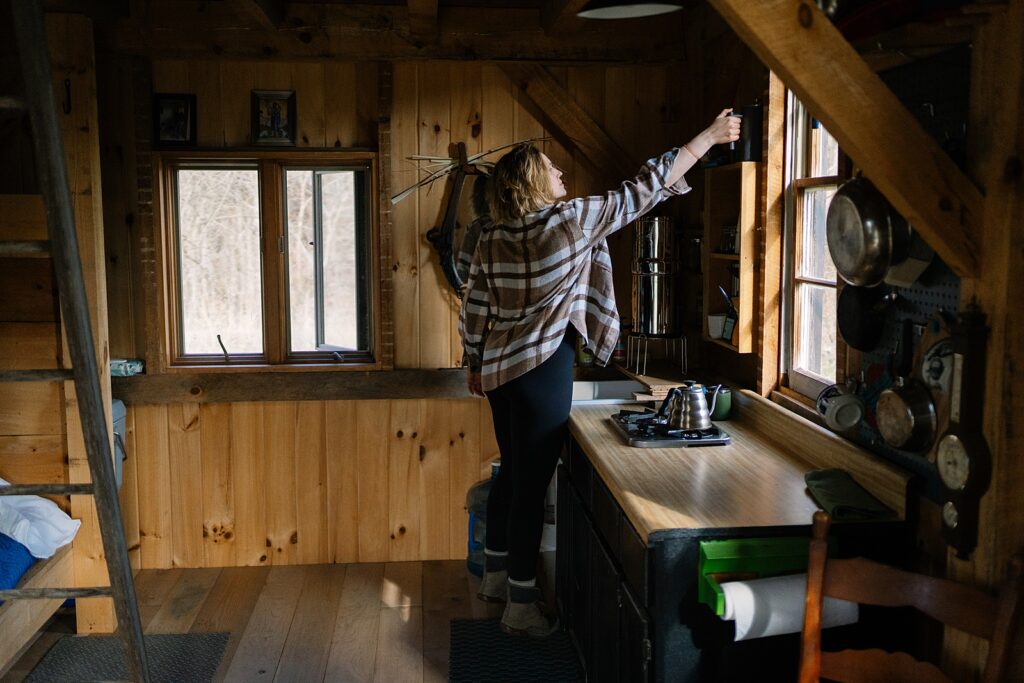 making a french press in cozy off-grid cabin, travel photographer for hire, travel photographer, Hipcamp photographer